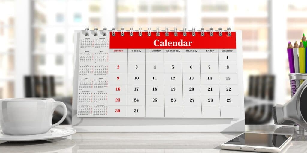 Calendar and a cup of coffee, office background. 3d illustration